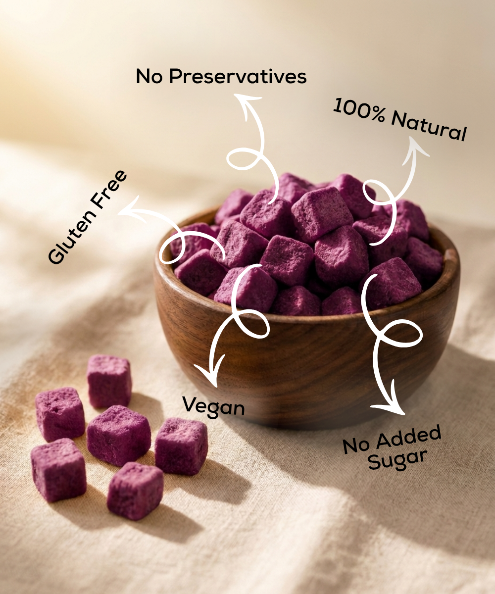 A wooden bowl of Moon Freeze Dried Jamun Cubes from Themoonstoreindia, labeled gluten-free, vegan, 100% natural, with no preservatives or added sugarβa perfect healthy treat for natural sugar cravings.