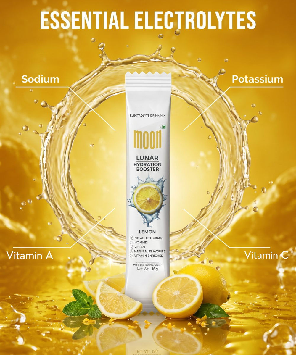 A packet of Lunar Hydration Booster - Lemon Flavour by MOONFREEZE FOODS PRIVATE LIMITED is shown with splashing water and lemons, highlighting electrolytes, sodium, potassium, vitamin A, and vitamin C for optimal hydration.