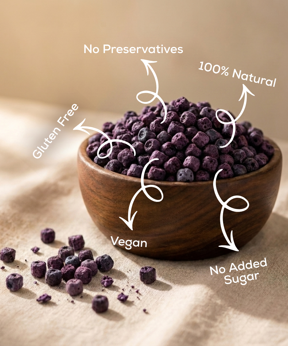 A wooden bowl filled with Themoonstoreindia Moon Freeze Dried Blueberryβantioxidant-rich, 100% natural, gluten-free, vegan, with no preservatives or added sugar.