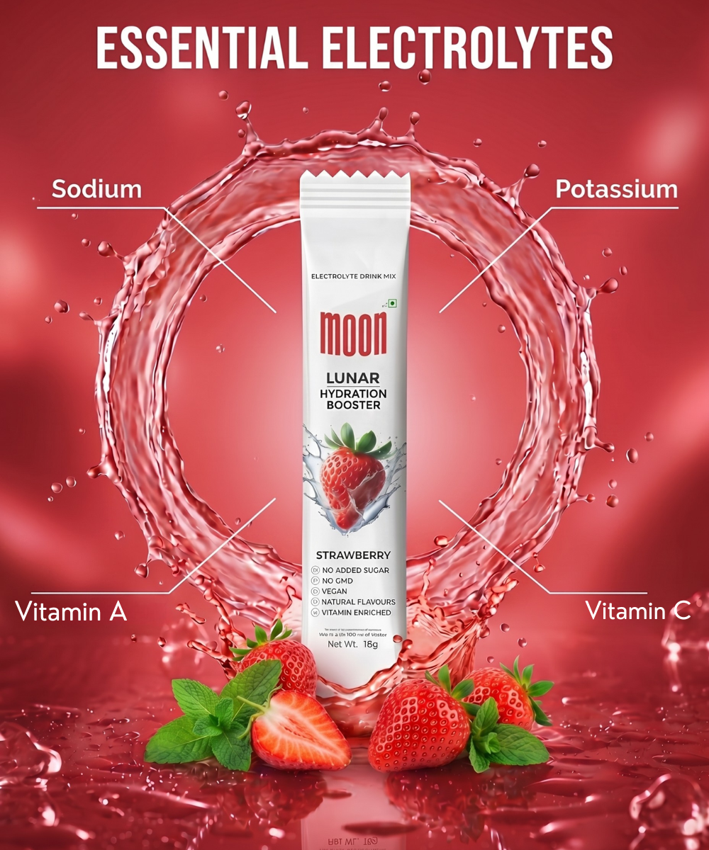 A packet of Lunar Hydration Booster - Strawberry Flavour by MOONFREEZE FOODS PRIVATE LIMITED is surrounded by strawberries, highlighting its electrolytes—sodium, potassium—and vitamins A and C for tasty hydration.
